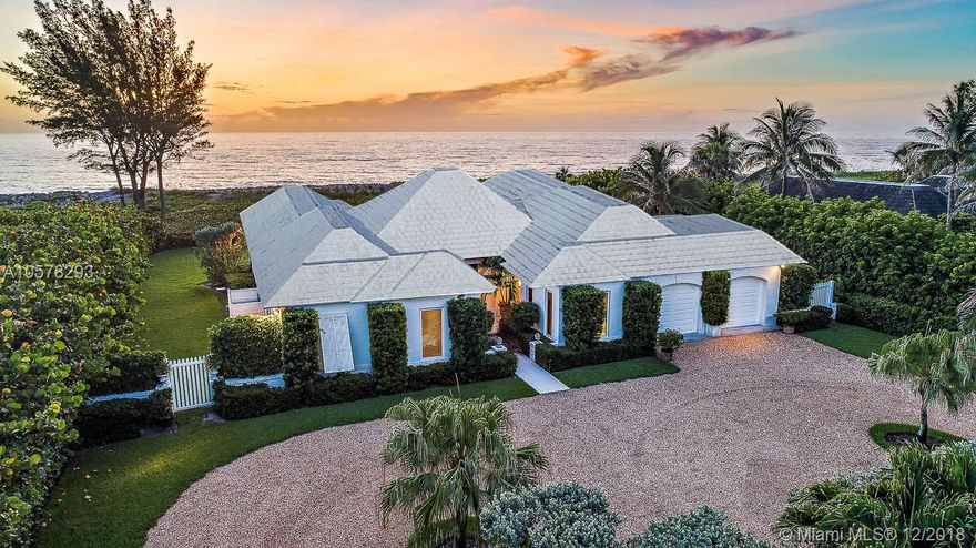 COMPLETELY RENOVATED IN 2012, this spectacular 1 acre direct oceanfront property enjoys 120' of secluded Jupiter Island beach frontage. The sophisticated four bedroom house includes a study and has been finished with beautiful contemporary architectural details throughout. The kitchen incorporates top of the line appliances and the baths are designed with elegant marble and tile. It features large entertaining spaces which overlook an inviting pool area surrounded by lush green lawn. This Island oasis is flooded with light from tall, wide windows and doors and offers SIGNIFICANT EXPANSION POSSIBILITIES up to approx. 7500 to the existing house or one could build a new guest house. Attached two car garage is spacious enough to accommodate golf cart storage and water toys.