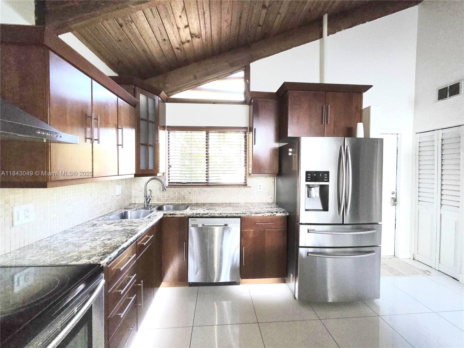 Beautifully updated 2-bedroom, 2-bathroom single-family home available for rent in the heart of Fort Lauderdale! This well-maintained home offers an open and airy layout filled with natural light. The kitchen features granite countertops, stainless steel appliances, and plenty of cabinet space. Enjoy a private fenced backyard with low-maintenance artificial grass, a Jacuzzi, and a storage shed—perfect for relaxing. The primary bedroom includes a walk-in closet and ensuite bathroom. The second bedroom includes a loft area that can be used for storage. Freshly painted and move-in ready!