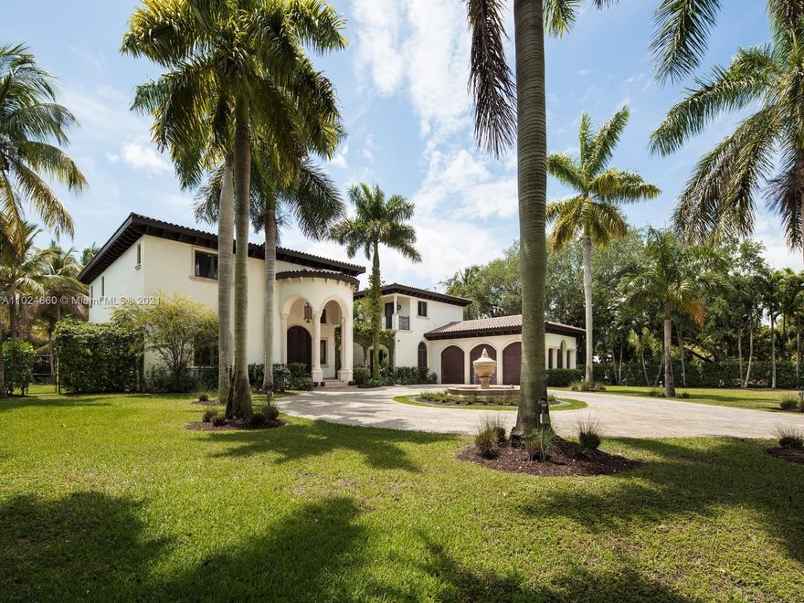 Magnificent one acre + estate located in South Miami. Surrounded by manicured and pristine landscaping, this spectacular property lies behind private gates showcasing an exquisite entrance & water feature. Greeted by volume ceilings, a grand foyer & elegant staircase, discover expansive living areas ideal for entertaining with 5 bedrooms & 7 bathrooms + home office + home theatre with 13 seats, recreational room featuring custom wet bar & temperature-controlled wine cellar, custom designed eat-in kitchen with Viking Appliances, & large family room. Master suite offers spa like bath & private terrace overlooking the outdoor oasis. Outdoor living awaits with large covered terrace, summer kitchen, stunning pool, and ample grounds. Extra Features: elevator, impact windows/doors, 3 car garage.