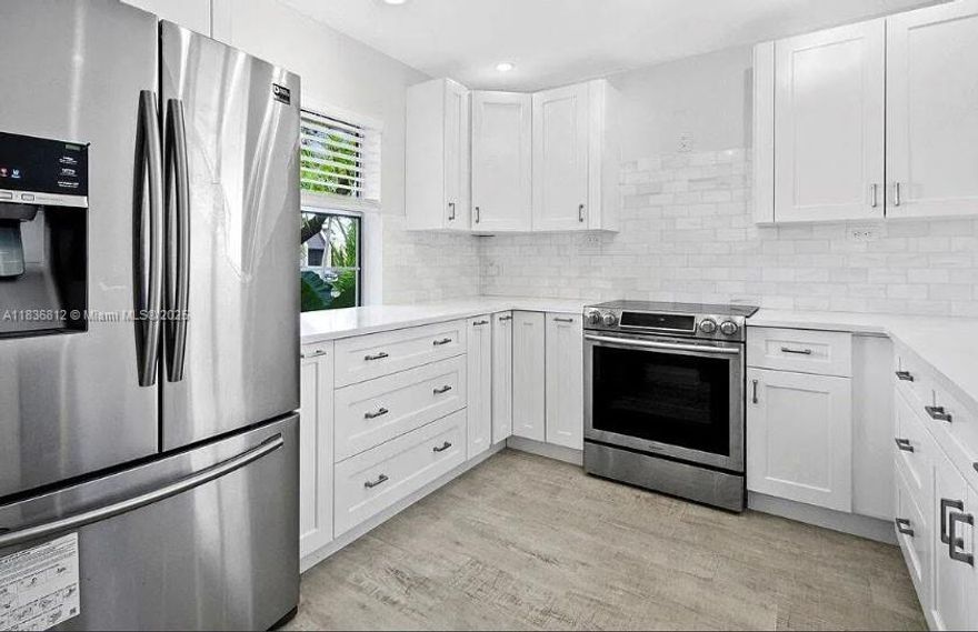 Bathed in golden light, this beautifully updated villa overlooks peaceful canal waters. Just a short stroll to the sparkling pool—yours to enjoy without the upkeep. Tucked at the end of a quiet lane with ample guest and RV parking, it sits in Golden Lakes Village, a vibrant 55+ community where laughter fills the clubhouse, trails wind through sun-dappled paths, and each day brings joyful gatherings. A full-time Lifestyle Director curates activities like live entertainment, weekly movies, dinners, aquatic aerobics, Zumba, lectures, and special interest clubs. Only 15 minutes to downtown West Palm Beach, the Kravis Center, shopping, and the airport.