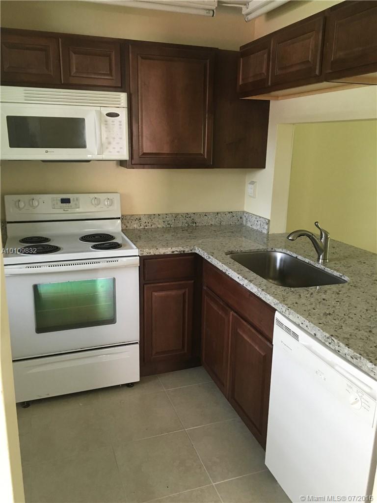 Just renovated ground floor corner unit with both water and golf views from screened patio, living room and master bed room, neutral tile though out , new kitchen cabinets , new base boards, new window treatments and freshly painted. Great community in the heart of Pembroke Pines with new roofs, renovated pool, recently painted, located close to everything - Hospital, Mall, Park, Restaurants, Major Highways, PETS >15LBS allowed and pet deposit required.