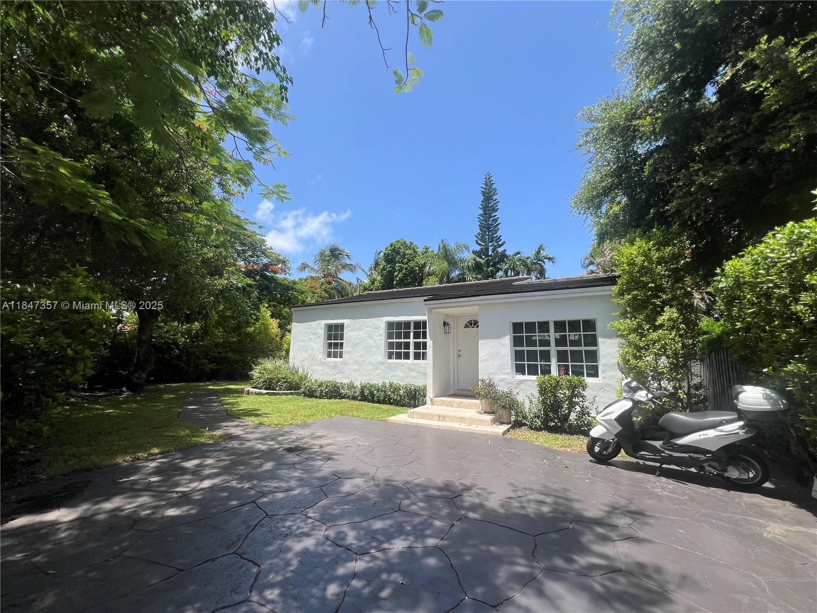 Enjoy living in this perfectly located remodeled and gated house just minutes from Brickell, Coconut Grove, & Coral Gables. This pretty and very spacious house has new roof, new and / or refinished wood floors, hurricane impact windows and shutters, refinished bathrooms, lots of closets and a beautiful backyard perfect for entertaining. **Easy to show**
