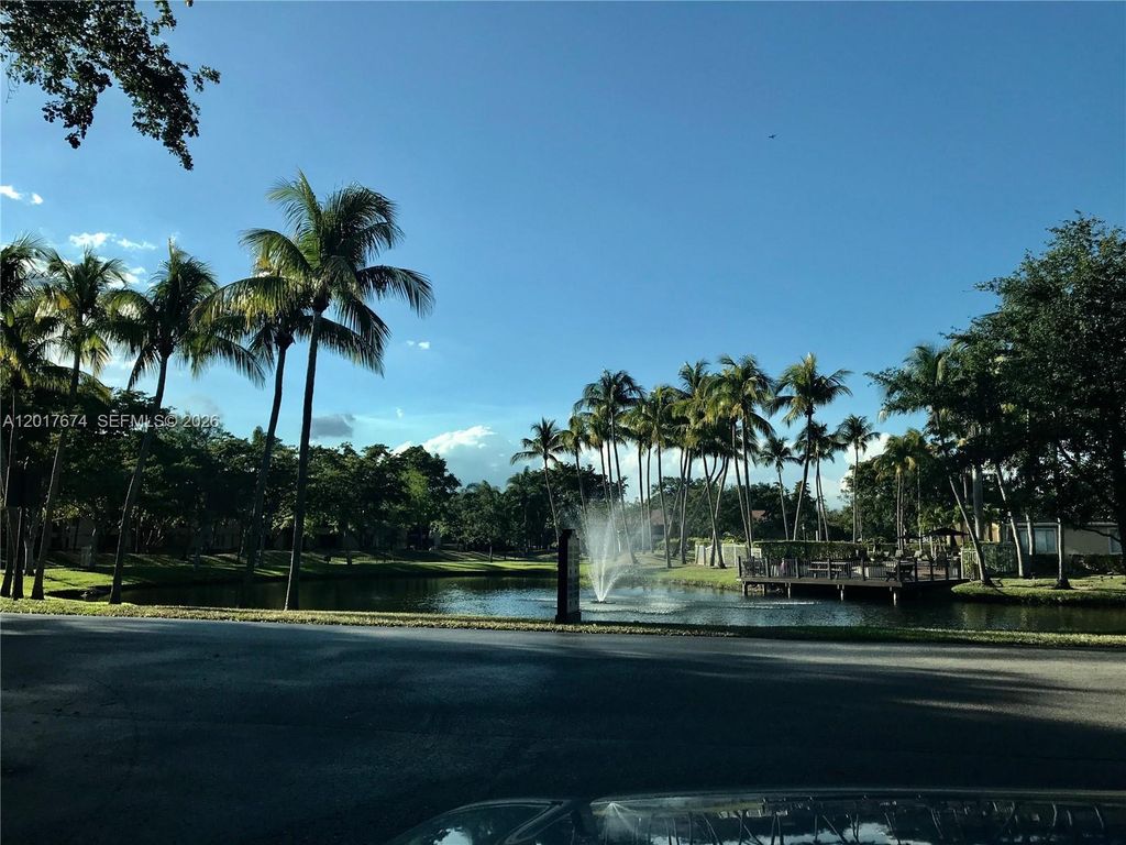 Photo of 651 Lyons Rd #10204, Coconut Creek, FL 33063 (MLS # A12017674)