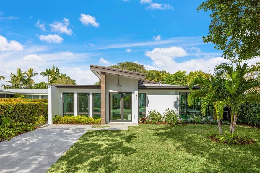 Welcome to modern luxury in the heart of Miami Beach. Surrounded by lush landscaping, this fully renovated home offers a spacious driveway and impeccable design. Inside, sleek French windows fill the space with natural light, highlighting elegant porcelain tile floors and a contemporary open-concept design. The chef’s kitchen features ample counter space, dual dishwashers, a wine fridge, and double sinks for entertaining or everyday living. Expansive bedrooms provide privacy and comfort, while the backyard transforms into your private retreat with a sparkling pool, cabana bath, and vibrant greenery. Located in a premier school district and just minutes from beaches, country clubs, and upscale dining, this home delivers style, functionality, and the perfect Miami Beach lifestyle.