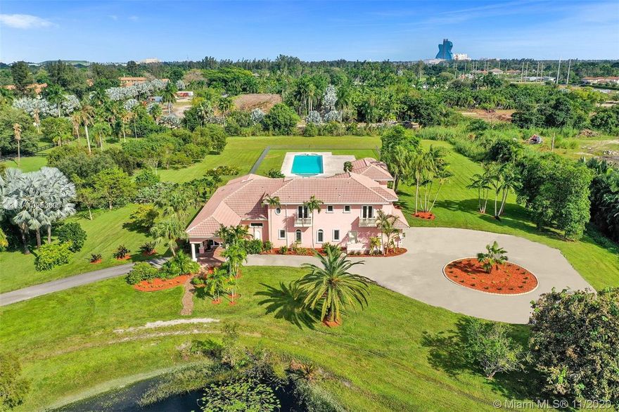 Fabulous opportunity for a sprawling, private estate in the heart of East Davie. 10 beautiful and quiet acres await you with easy access to major roadways, making any commute a breeze. This secluded, comfortable and unique home offers 8 bedrooms and 7.5 baths with a separate guest quarters; 6 bedrooms of which are their own private suites. Effortlessly host friends and family with the privacy afforded by this well-executed floor plan. This generous home includes a large 3 car garage, an incredible and refreshing 74 foot pool with an additional spa, hurricane impact windows, the comfort of a 4-zone HVAC system & plenty of room for horses. Take a relaxing stroll down the winding drive and discover your new luxurious paradise.
