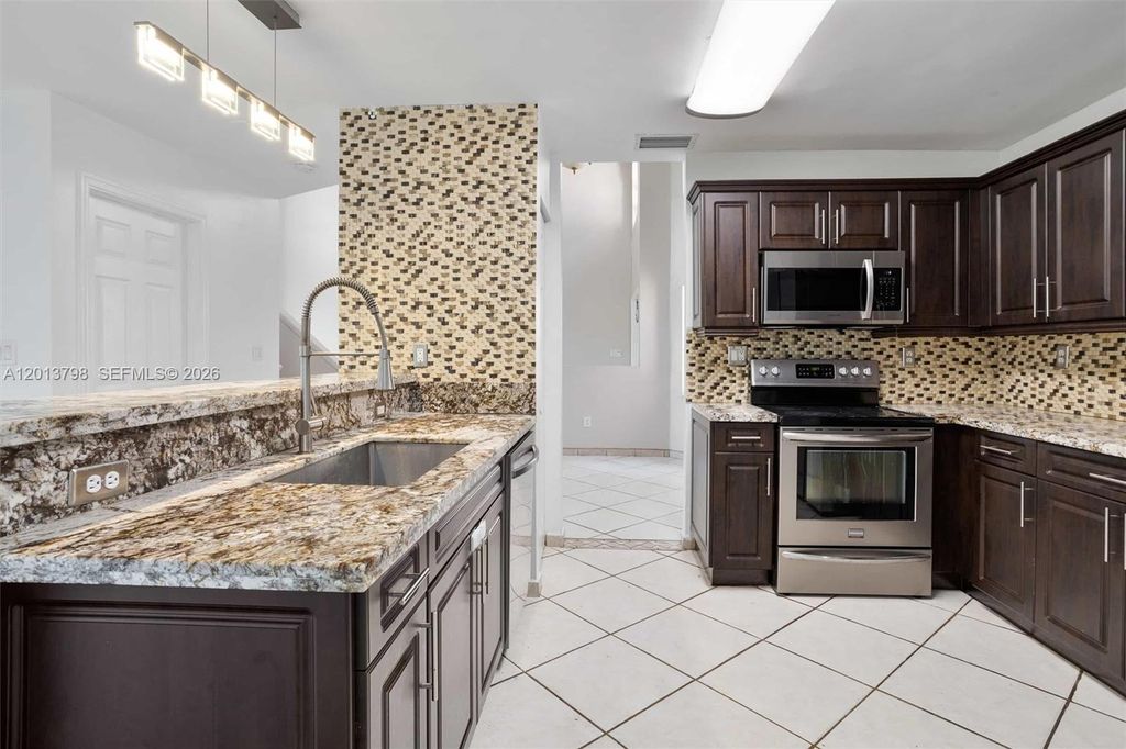 Photo of 192 SW 204th Ave #192, Pembroke Pines, FL 33029 (MLS # A12013798)