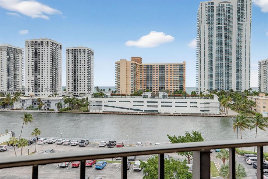 Beautifully maintained and turnkey furnished 1-bedroom, 1.5-bath residence offering a rare east-facing view of the Intracoastal Waterway and the ocean, showcased through floor-to-ceiling windows in every room. Located in the Oceanview Park Condominium, within the highly desirable Three Islands community of Hallandale Beach, this light-filled unit offers serene waterfront living with a spacious, functional layout. The condo features a beautifully updated open kitchen, stainless steel appliances. A standout feature is the rare primary bathroom configuration, offering both a separate bathtub and a walk-in shower, providing comfort and flexibility. The unit is move-in ready, investor-friendly, with the ability to rent from year one, making it an excellent option for end users and investors alike. The updated building is well managed, offering resort-style amenities including a heated waterfront pool, sauna, tennis courts, fitness center, 24/7 security, beautifully maintained common areas, and plenty of guest parking. Ideally positioned near the center of Hallandale Beach’s continued growth and transformation, just minutes from the beach, parks, shopping, dining, and entertainment, including Gulfstream Park Village and Aventura Mall. Enjoy convenient access to the Aventura Brightline Station, Fort Lauderdale–Hollywood International Airport, and Miami International Airport. Nearby luxury developments continue to elevate the area and contribute to strong long-term value!