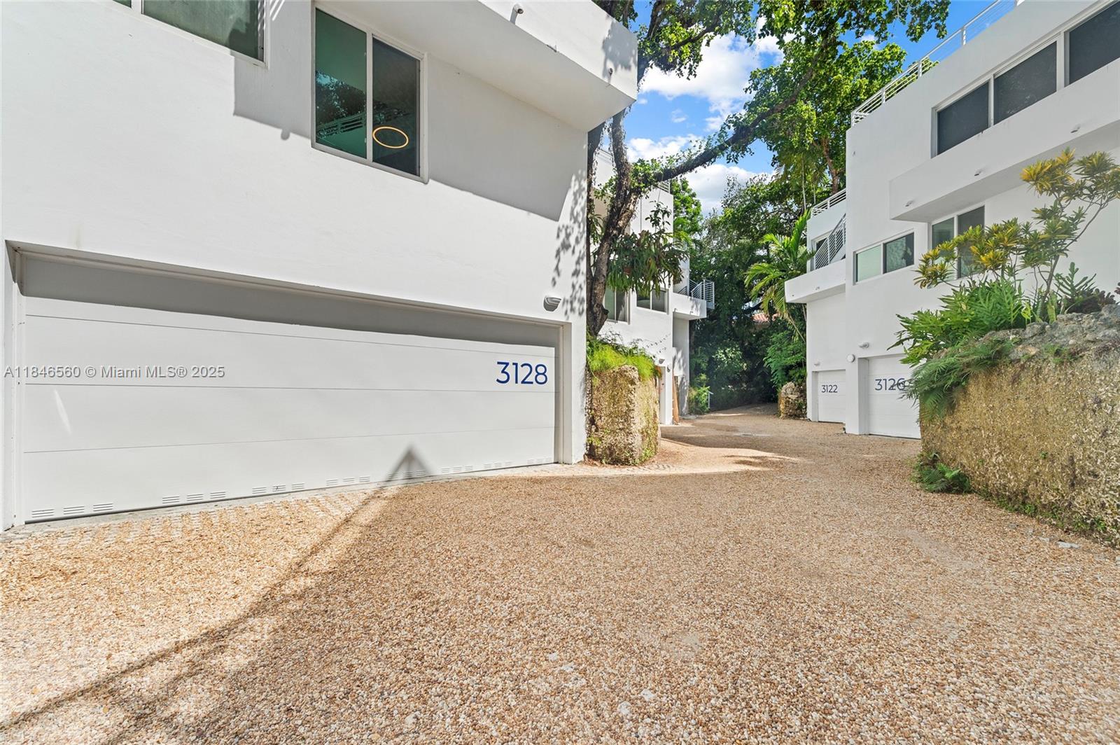 Vibrant, multi-level townhouse nestled in a hidden Coconut Grove oasis .This unique home offers an open-plan design defined by level changes, instead of walls. Floor to ceiling windows brighten the spacious living and dining areas with natural light. Renovated kitchen and bathrooms offer the perfect blend of style and design to the home while additional improvements include a new roof, exterior staircase, impact windows and doors, and AC. A private rooftop terrace, loft in the 2nd bedroom, 2 car garage and large fenced patio for year-round outdoor living are notable features that enhance the space of the home. The location can’t be beat! Walking distance from Coconut Grove’s parks, eateries, shops, marinas and more.