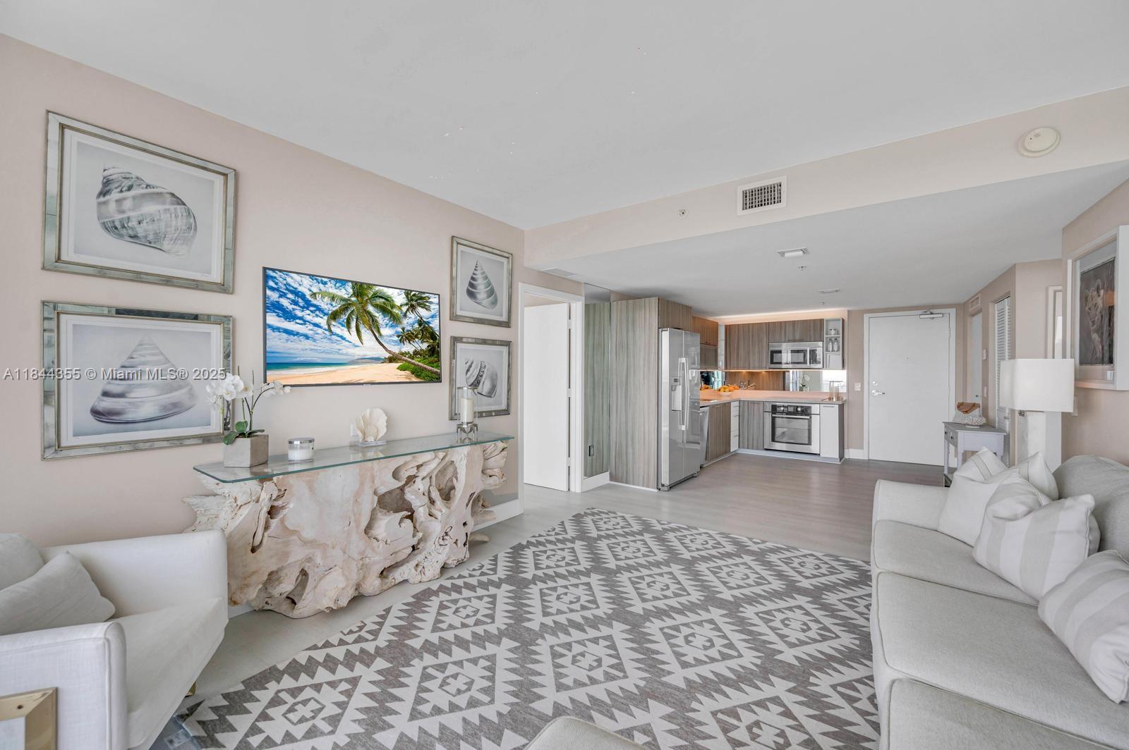 Experience resort-style luxury in this beautiful 2 bed, 2 bath corner residence on the 14th floor of Eden House. Spanning 952sqft, the unit boasts panoramic views of the Intracoastal, Biscayne Bay, and Miami skyline from wrap-around terraces. High-end finishes include custom bathrooms, porcelain floors, in-unit washer/dryer, and a modern kitchen with stainless appliances. Enjoy seamless indoor–outdoor living with floor-to-ceiling glass sliders that flood the space with sunlight. Eden House residents benefit from world-class amenities: bayfront pool, fitness center, sauna, Jacuzzi, 24-hour front desk, valet parking, and concierge. Located in North Shore, you're steps from the beach, shops, and top dining, with easy access to South Beach and downtown. Available for Lease.