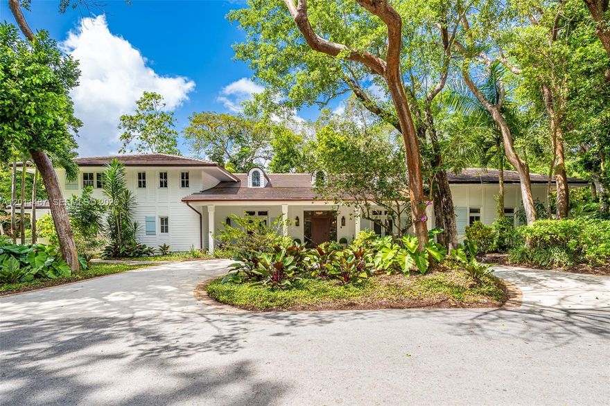 Tucked away in the serene guard gated enclave of Hammock Lakes, this masterfully enhanced 5-bedroom, 4 bathroom, 2 half bathroom residence showcases thoughtful upgrades designed for timeless comfort. Every detail has been meticulously crafted by renowned architect and builder John Roberts Forbes, offering peace of mind and modern efficiency. This recently rebuilt home blends quality construction with elevated living. Inside, enjoy the warmth of a wood-burning fireplace, a luxurious Kohler soaking tub with heater, and a rejuvenating Mr. Steam steam bath. The home is designed for seamless living, featuring a house Sonos sound system, Brilliant smart lighting, Unifi WiFi extenders, and Ring security. Entertain effortlessly with state of the art kitchen including Wolf and Sub Zero appliances, outdoor salt water pool, wet bar, lush landscaping and a large backyard with a fire pit, this home is truly exceptional. No expense was spared.