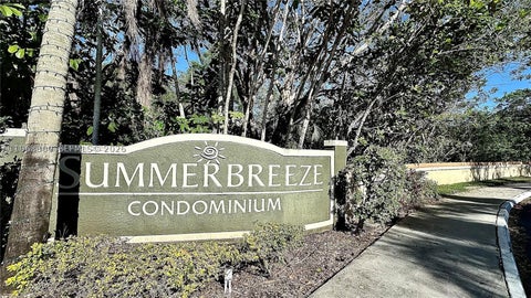 Photo of 9999 Summerbreeze Dr #101, Sunrise, FL 33322 (MLS # A11963300)