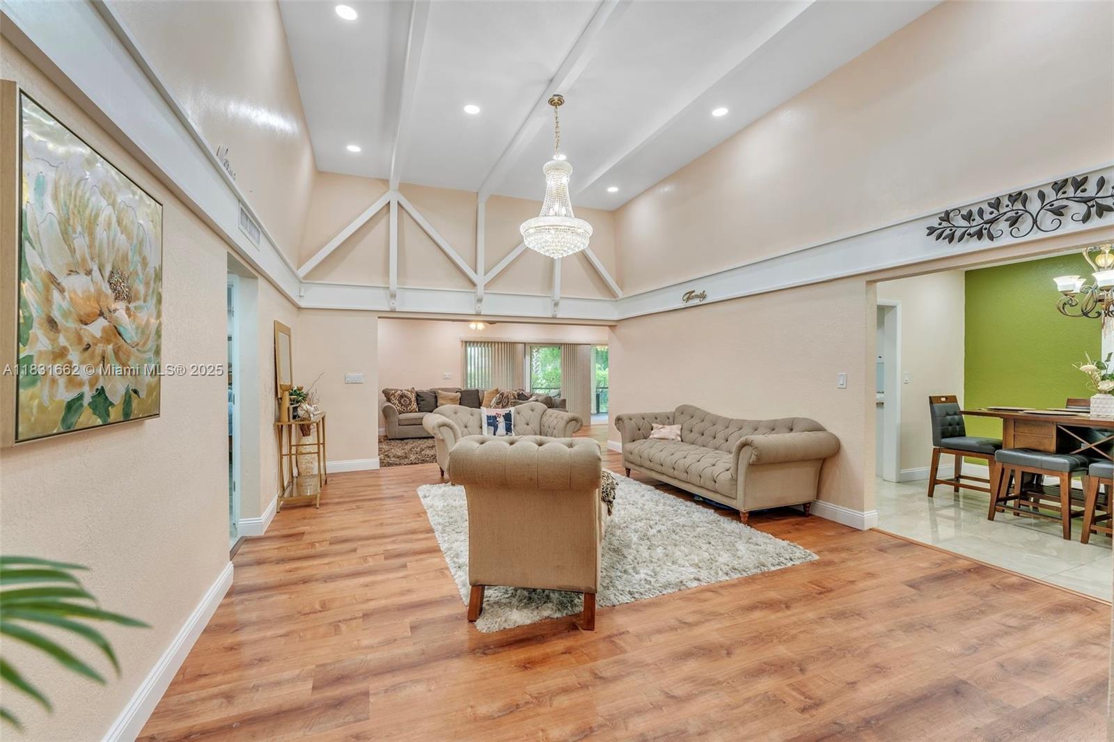Welcome to your dream home! This stunning 3-bedroom, 2-bath residence features an additional versatile room ideal for a home office, playroom, or guest space. Enjoy a spacious two car garage with golf cart parking, an in-ground pool and spa, impact windows, doors, and sliding glass doors, plus recessed lighting throughout. The updated kitchen boasts new stainless steel appliances, tile floors, and new vinyl flooring in select areas. A 2020 roof and energy-saving solar panels add long-term value. Located in a desirable area, this home blends comfort, efficiency, and style perfect for modern living.