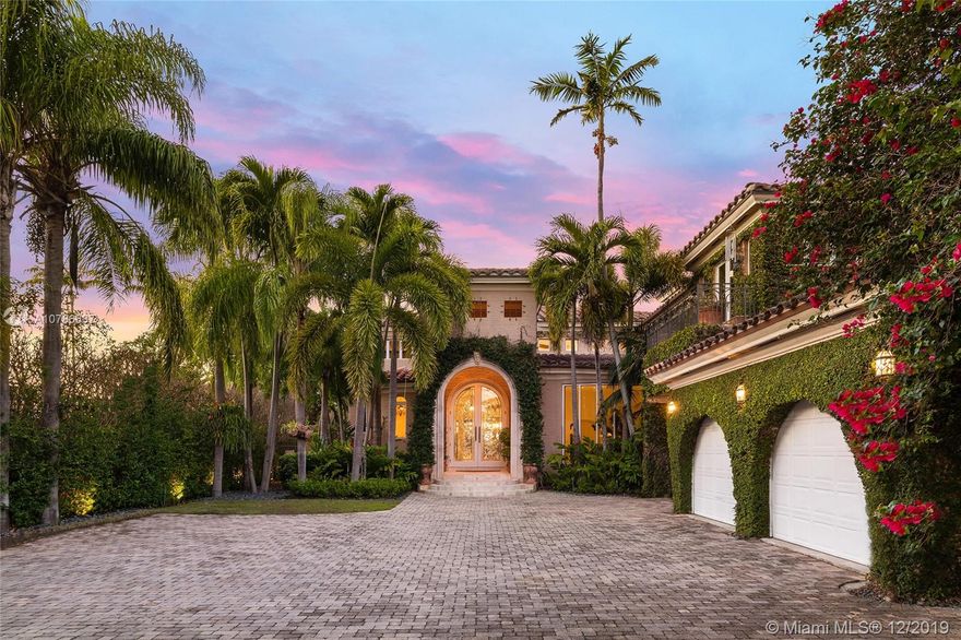 This elegant 2-Story Mediterranean waterfront Villa on prestigious guard-gated La Gorce Island exemplifies luxury living. The residence sits on a lush manicured 18,000 sf lot featuring exquisite natural stone & rich hardwood floors, interior elevator, soaring ceilings, stunning double-sided staircase, formal living & dining areas, gym & an amazing family room. Open gourmet kitchen sports top-of-the-line appliances, granite counter tops/center island & breakfast area. The 2nd story principal suite has an office space, private balcony facing the waterway & bathroom w/voluminous dual closets. 100 FT on the Intracoastal Waterway, large pool w/Jacuzzi, covered terrace, cabana/bar, summer kitchen, double jet-ski lifts, private dock & industrial generator complete this amazing residence.