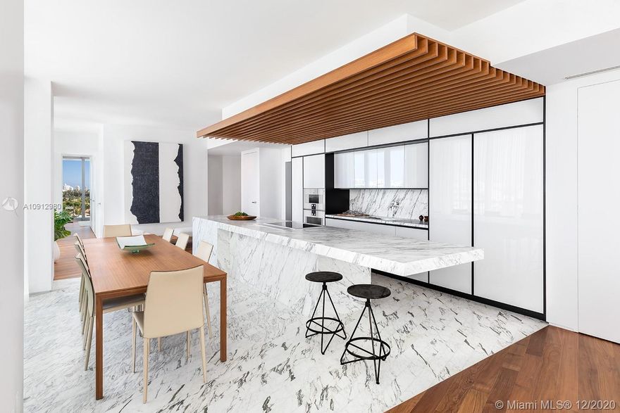 Direct Bay, City and Ocean views from this 3 bed, 3.5 bath corner residence at Monad Terrace. Composed of 59 individually designed waterfront residences around a glittering lagoon, Monad Terrace by Pritzker Winner, Jean Nouvel, provides brilliant light, private outdoor space, climbing gardens, unique saw-tooth honeycomb facades & stunning sunset views of Biscayne Bay. Kitchens with dramatic sculptural cantilevered marble island in Calcutta. Master baths with richly veined, spacious stone countertops, marquetry flooring and tiled walls. Other notable features include custom cabinetry & built-in features, designer fixtures, oak flooring throughout & private elevators. Estimated delivery in 2020.