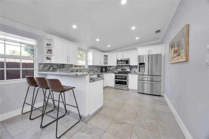 Zoned and legal single-family currently configured as an ideal dual-income opportunity in a high-demand rental area. The main home offers 2 bedrooms, 1.5 baths, an office/den nook, and updated kitchen and bathrooms. The west wing is arranged as a private 1/1 suite complete with its own central A/C living area, kitchenette, and its a separate patio—perfect for rental income or multigenerational living. Property features include impact windows, a new roof, and a large paved, gated driveway. Conveniently located just steps from Coral Gables and minutes from Miami Int'l Airport, Downtown, and Brickell, making it highly attractive for long-term or mid-term rentals.