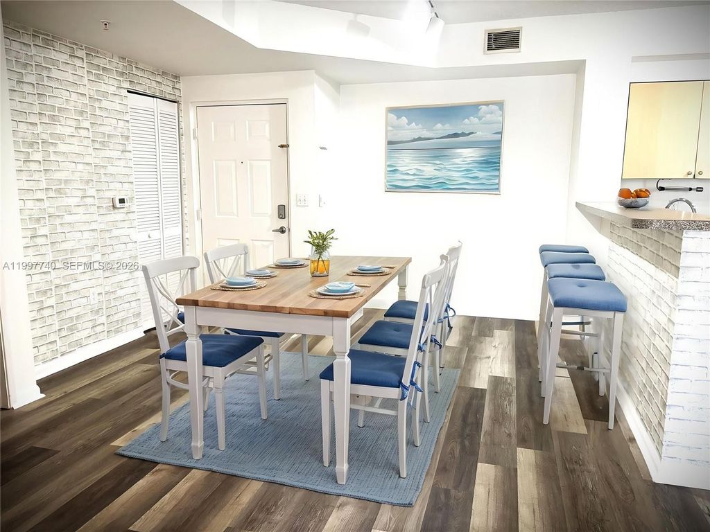 Photo of 8050 N Nob Hill Rd #105, Tamarac, FL 33321 (MLS # A11997740)