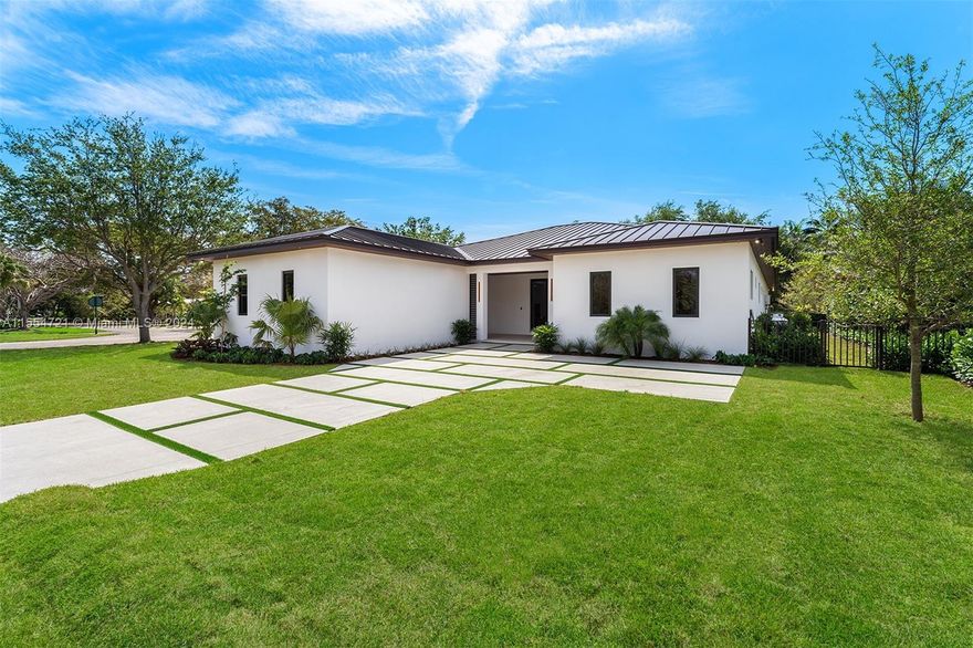 Step into this contemporary masterpiece constructed in 2024, nestled in sought-after Pinecrest. With a total area of 5,235 sq.ft. on a 16,966 sq. ft. lot. Featuring 5 bedrooms, 5 bathrooms, and a 2-car garage. The entrance leads to a spacious living area seamlessly blending with a state-of-the-art open kitchen equipped with Thermador appliances. Adjacent, a well-appointed wine cellar awaits. Thoughtful design ensures fluid transitions between living, dining, and entertainment areas, extending to a family room. Each bedroom boasts its private en-suite bathroom.The luxurious primary suite offers a serene retreat with a lavish bath featuring dual amenities and a freestanding tub.Outdoors, enjoy terraces, an outdoor built-in kitchen, and a beautiful pool with deck jets. Near top-tier schools.