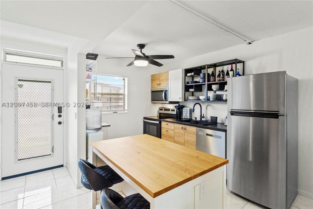 Photo of 2901 NW 46th Ave #307, Lauderdale Lakes, FL 33313 (MLS # A12097458)
