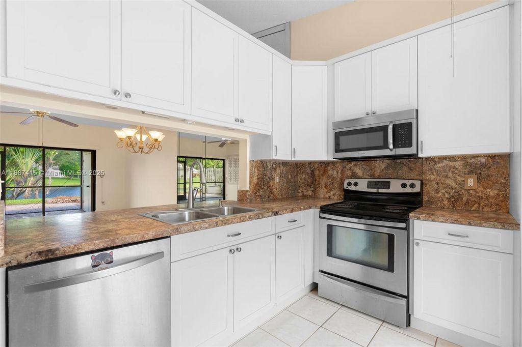 Photo of 5145 E Lakes Dr, Deerfield Beach, FL 33064 (MLS # A11887415)