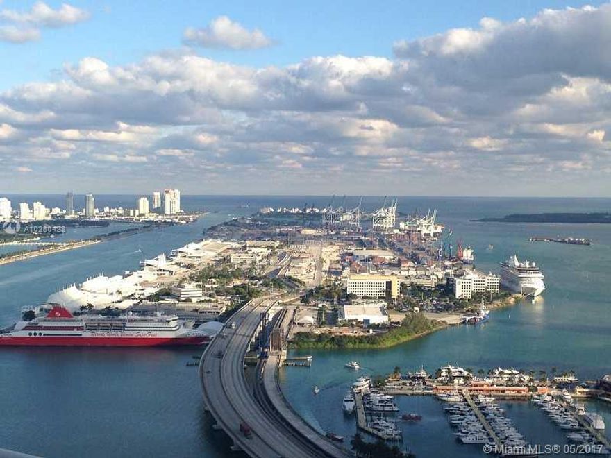 UNOBSTRUCTED SPECTACULAR VIEW OF BISCAYNE BAY, MIAMI BEACH, PORT OF MIAMI AND MORE!! UNIT HAS 1 MASTER BEDROOM PLUS DEN, CALIFORNIA CLOSETS, HIGH CEILING, DARK GRAY LAVA STONE FLOOR. Sunrise and sunset swimming pools, hot tub and plunge pool, fitness center, 24 hour security and concierge 24 hour valet parking, business center, yoga/aerobics room, party room, BBQ gills and outdoor dining area, 5-hole putting green, sand volleyball court and Wi-Fi Internet access throughout the lobby and amenities deck.