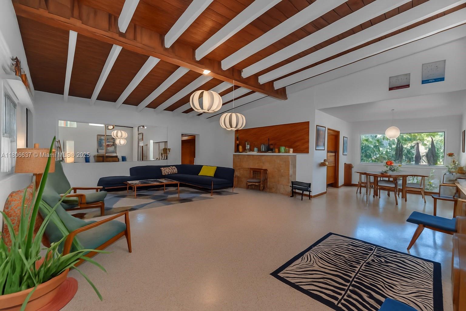 Welcome to Casa Palmera! This mid-century modern gem sits on a quiet cul-de-sac located just minutes from Coconut Grove. Nestled in a lush tropical garden, this home boasts true modernist style with large windows, beamed ceilings, original terrazzo and parquet wood floors. The bathrooms have been tastefully renovated to match the original design intent. This home can be enjoyed as a 3/2 with a separate 1/1 or can easily be transformed back into a 4/3.