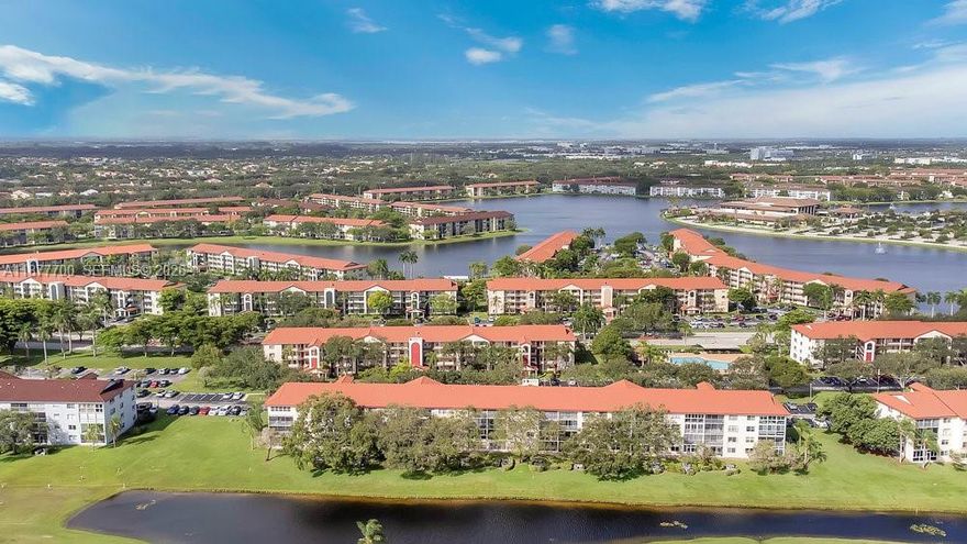 Large and Beautiful 2 bed/2 bath condo offering stunning views of the lake, golf course, and endless blue skies from its open balcony. Brand New A/C just changed in Jan 2026, Dishwasher and Range-e (changed 2022), washer and dryer changed 2024. The remodeled kitchen is large enough for a cozy breakfast nook, while tile flooring enhances the main living areas, and warm wood floors add comfort to the bedrooms. This apt also features a generous walk-in closet in the master bedroom. The Master Bathroom is completely remodeled. Impact windows throughout and a sliding door in place. Brand new zebra shades for privacy. Enjoy the swimming pool conveniently located in front of the Cambridge building, with the clubhouse just a short stroll away. At least one owner must be 55+, while additional residents can be 18 or older. Condo offers resort-style. Maintenance includes water, basic cable TV & elevator. Furniture is negotiable.