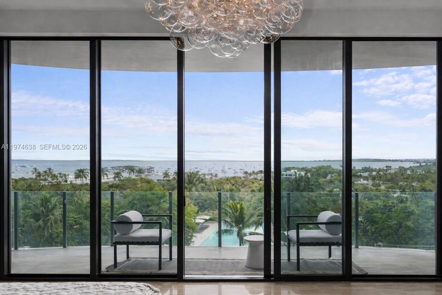 Fully remodeled 3BD/3.5BA in coveted Two Park Grove with sweeping bay views and refined designer upgrades throughout. This 3,233 SF residence features Eggersmann custom cabinetry, an ITALKRAFT kitchen and primary bath, Sub-Zero & Wolf appliances, Calacatta marble, and Dornbracht and Franz Viegener fixtures. Curated finishes include Murano and Baccarat lighting, Lindsey Adelman fixtures, silk and grasscloth wall coverings, and Italian doors by Mia Cucina. A 250-bottle Sub-Zero wine column, smart prewiring, built-in Murphy bed, and three storage units enhance both functionality and luxury. Two private balconies and two assigned parking spaces complete the residence. Residents enjoy valet, full-service spa, state-of-the-art fitness center, yoga and Pilates studios, theater, resort-style pools, and a private restaurant. An exceptional turnkey offering in the heart of Coconut Grove, just moments from waterfront parks, marinas, and the neighborhood’s premier dining and shopping.