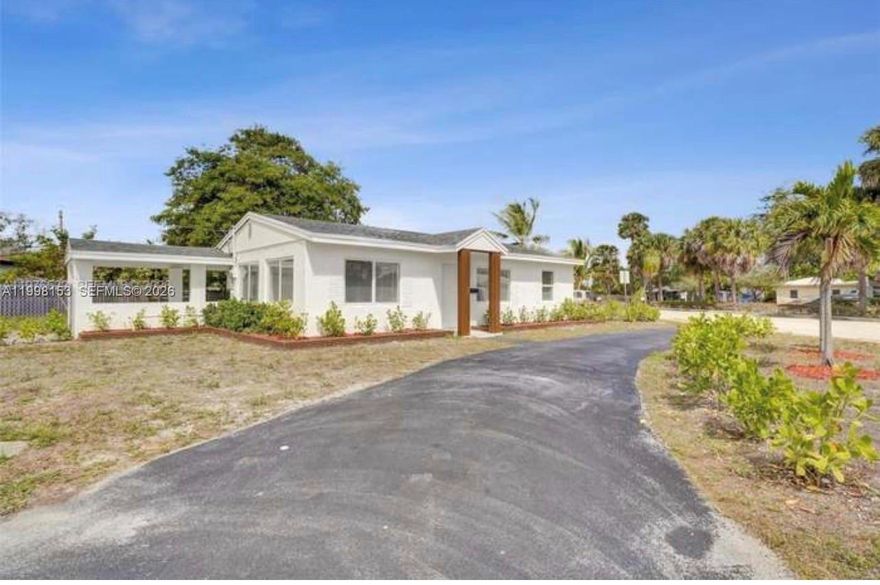 Fully Remodeled Corner Lot Home Move In Ready!    Welcome to this beautifully renovated 2-bedroom, 2-bathroom single-family home located on a desirable corner lot in Oakland Park. This property offers modern upgrades, spacious outdoor living, and peace of mind with major improvements already completed.   
The home features a brand new 2025 roof, impact windows and doors with permits, and a 2019 A/C system, providing both style and long-term value.    Inside, you’ll find a bright and welcoming layout with updated finishes throughout. The home sits on a 7,372 sq ft lot, offering a large private backyard perfect for entertaining, park a boat or adding a pool.  Parking is convenient with front driveway space plus a covered carport.   NO HOA. Conveniently located near shopping, restaurants, major highways, and just minutes from the beach.    Perfect for homeowners or investors to rent for $3000 or do Airbnb.