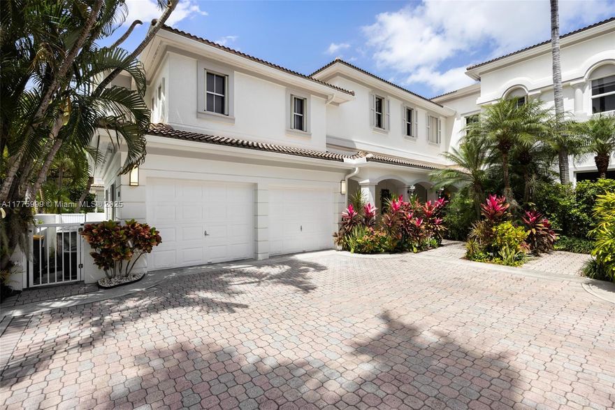 Located in the exclusive Courtyard Homes at The Point, this immaculate waterfront residence offers 12' ceilings, marble floors, and a spacious two-story layout. A private in-law suite with separate entrance adds flexibility, while the updated chef’s kitchen features professional-grade Viking appliances and sleek stainless finishes. The deeded dock sits on a deep-water, wide canal with 220V service, water, and direct Intracoastal access just minutes to the ocean, ideal for boaters. Enjoy resort-style amenities in this gated, full-service community, including spa, fitness center, salon, restaurant, and tennis courts.