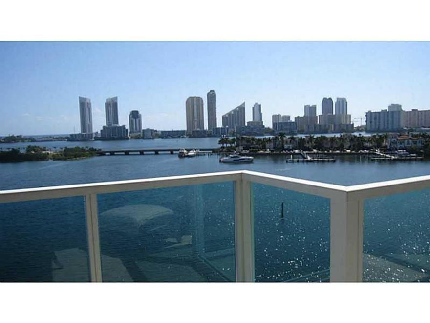 RESORT LIFE STYLE AT PENINSULA I , FABULOUS OVERSIZED 2 BEDROOMS PLUS DEN AND 2.5 BATHROOMS, LARGE LIVING ROOM WITH A MAGNIFICENT WATER VIEW, GOURMET KITCHEN ,CROWN MOULDINGS THROUGHOUT,  MARBLE FLOORS, PRIVATE ELEVATORS, AND PRIVATE FOYER, 2 PARKING SPAC ES,UNIT WAS BARELY USED AS A SECOND HOME, IN EXCELLENT CONDITION INCLUDES GYM, POOLS, SPA, TENNIS COURT. THE UNIT IS ALSO AVAILABLE FURNISHED.