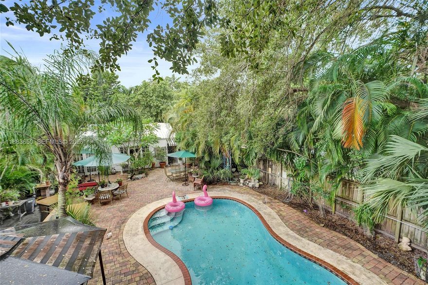 Set on a desirable corner lot in W. Miami Shores, this 4 bed 5 bath home welcomes you with lush grounds and a tranquil oasis-like setting. The front yard feature a sparkling pool, treehouse, outdoor kitchen with rose granite counters, hibachi, fireplace, and multiple areas designed for entertaining or relaxing. Inside, the home showcases unique character with tile and porcelain floors, speckled granite kitchen, indoor fireplace, custom stained glass accents, floor-to-ceiling spa-style baths, and private bedroom kitchenettes providing flexible living options. Additional highlights include eco-friendly touches, two split A/C units, and five bidet baths. Income-generating property, located near top-rated schools, dining, boutique shopping, the Design District, Downtown, beaches. Please ask us about the 3-2-1 approved lender buydown. Meaning you get an interest rate as low as 3% with a monthly payment probably lower that what you're paying in rent!! Unpack & enjoy...
On Zillow, scroll down to "facts & features", click on "show more", then click "View virtual tour" for your Virtual Interactive Lifestyle Concierge! Ask anything. Explore everything.