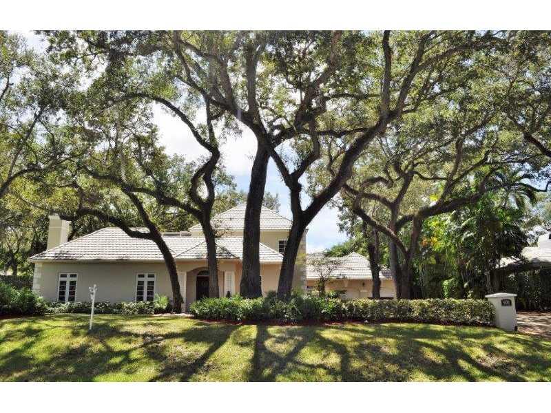 Remodeled 4 bdrm 4.5 bath home in prestigious, gated Hammock Oaks. Impressive 18,500 sf lot with mature oak trees. 2/2 upstairs & 2/2.5 downstairs. Kitchen w/granite countertops & SS appliances. Natural stone & oak wood floors throughout. Master Bath w/do uble vanity, Jacuzzi tub & Noche Travertine details! Balcony overlooking peaceful backyard w/screened sparkling pool. Highly desirable location near Fairchild Tropical Gardens & Pinecrest Schools.