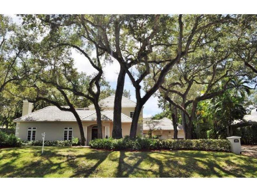 Remodeled 4 bdrm 4.5 bath home in prestigious, gated Hammock Oaks. Impressive 18,500 sf lot with mature oak trees. 2/2 upstairs & 2/2.5 downstairs. Kitchen w/granite countertops & SS appliances. Natural stone & oak wood floors throughout. Master Bath w/do uble vanity, Jacuzzi tub & Noche Travertine details! Balcony overlooking peaceful backyard w/screened sparkling pool. Highly desirable location near Fairchild Tropical Gardens & Pinecrest Schools.