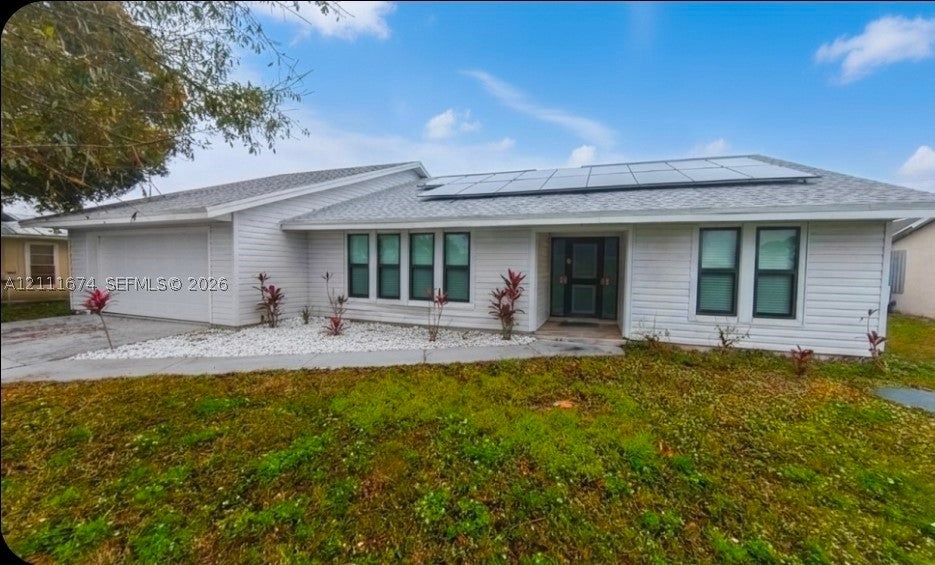 Photo of 333 NE Greenbrier Ave, Port St Lucie, FL 34983 (MLS # A12111674)
