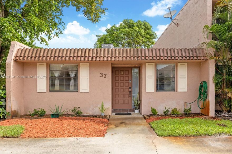 Beautiful and rarely available 1-story townhouse-style condo in the heart of Valencia Village, Davie! This 2-bedroom, 2-bath home features a split floor plan, updated kitchen with new appliances, new flooring, updated water heater, and popcorn ceiling removed for a modern, clean look. Enjoy a private open patio and peaceful community surroundings that neighbor Davie Golf Club. Community amenities include 2 pools, clubhouse, tennis courts, and open green spaces. HOA covers building exterior, roof repairs, lawn care, landscaping, pool service, trash removal, common area insurance, and more. Rentals allowed after 2 years of ownership. Pet-friendly and centrally located near Nova Southeastern University, major highways, dining, and shopping. Easy to show. Don’t miss this one!