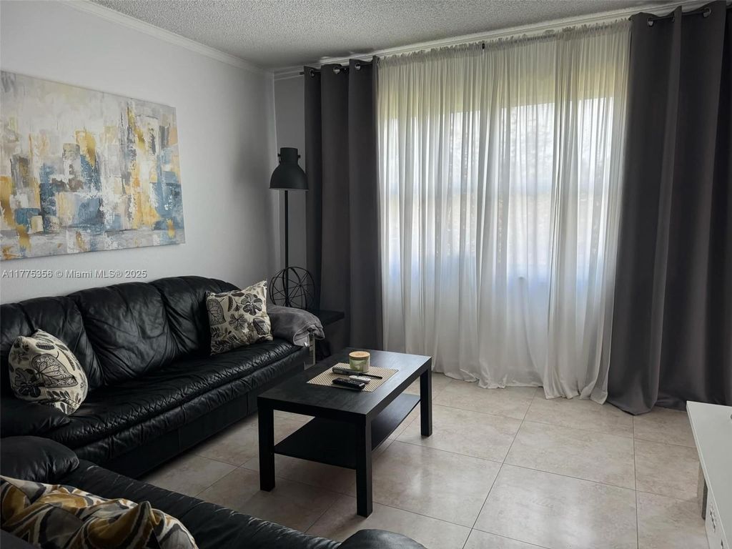 Photo of 3430 NW 52nd Ave #207, Lauderdale Lakes, FL 33319 (MLS # A11775356)