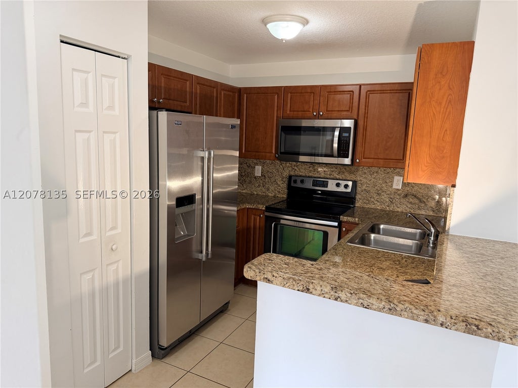 Photo of 14377 SW 11th St #2610, Pembroke Pines, FL 33027 (MLS # A12078135)