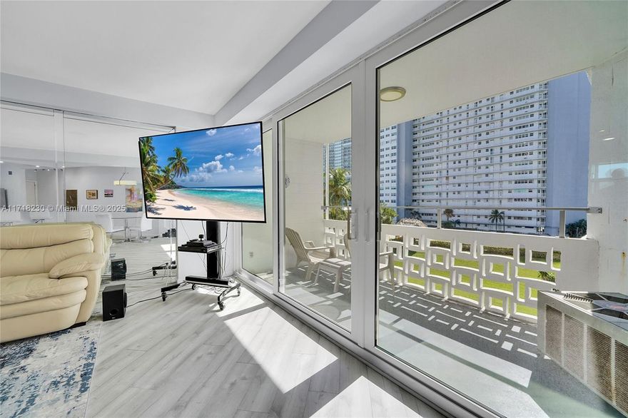 Just across from the beach! Designed by mid-century master designer Charles McKirahan Sr this building is a gem with tastefully modern decor and classic Art Deco architecture. All updated interior with washed french oak wood look flooring, updated open kitchen with porcelain tile large slab countertops, plenty of cabinetry and storage, updated lighting, brand new central A/C, impact glass windows and french door sliders, accent lighting, app-controlled features, and peaceful garden setting to enjoy from your balcony.  24 hour security/lobby concierge, mail room, pool, sundeck, tiki bar and BBQ area.  Beach side residential neighborhood just a short walk/bike/drive to all the best restaurants, shopping and entertainment. Do not miss this opportunity to own your piece of paradise.