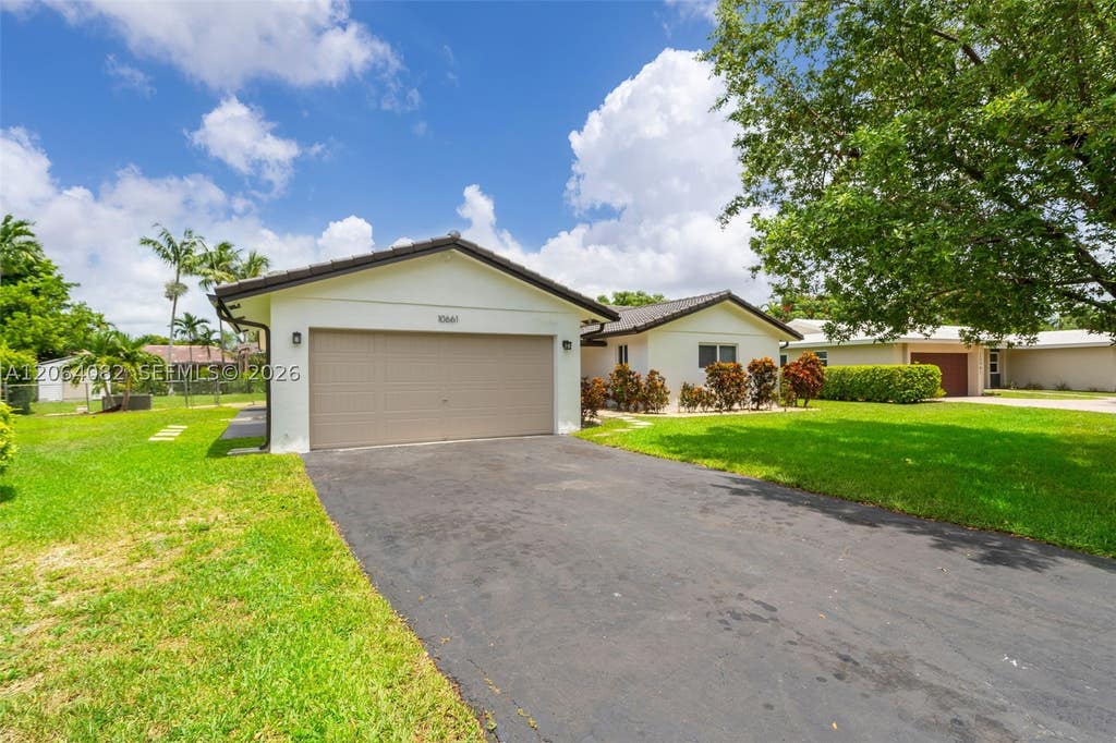 Photo of 10661 NW 43rd Ct, Coral Springs, FL 33065 (MLS # A12064082)