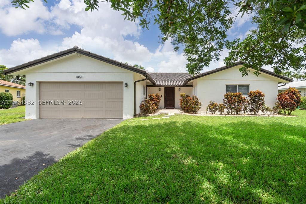 Photo of 10661 NW 43rd Ct, Coral Springs, FL 33065 (MLS # A12064082)
