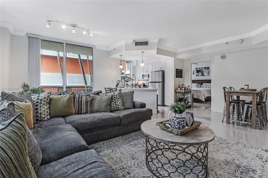 Coveted Corner Unit in Cite w/2 parking spaces in Edgewater! Open kitchen boasts ample cabinetry, granite counters, & SS appliances. The generous split floor plan is complimented w/light porcelain tiles thru-out; large impact glass windows & doors afford natural sunlight. Custom built office in one of the bedrooms with Murphy bed is perfect for a home office/guest bedroom. All BRs are spacious w/large closets & in unit laundry room! Cite offers heated beach entry pool, spa, Techno gym, concierge, 24 hr security & onsite Management. Across from Margaret Pace Waterfront Park, w/tennis, volleyball basketball, children's play area & dog park! Stroll to restaurants, theater, Publix or jog across the Venetian Causeway. Cite is LARGE pet friendly.