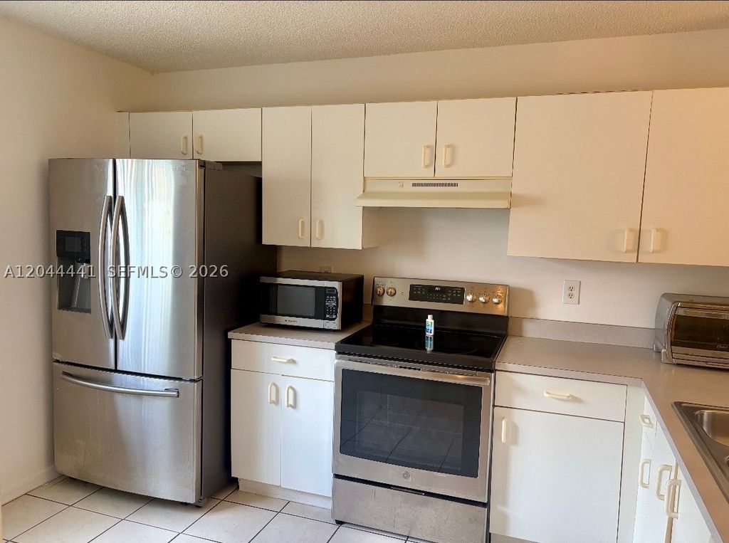 Photo of 829 NW 208th Way, Pembroke Pines, FL 33029 (MLS # A12044441)