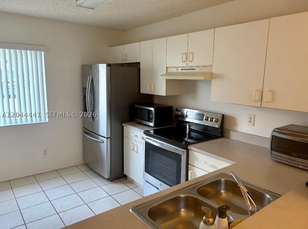 Photo of 829 NW 208th Way, Pembroke Pines, FL 33029 (MLS # A12044441)