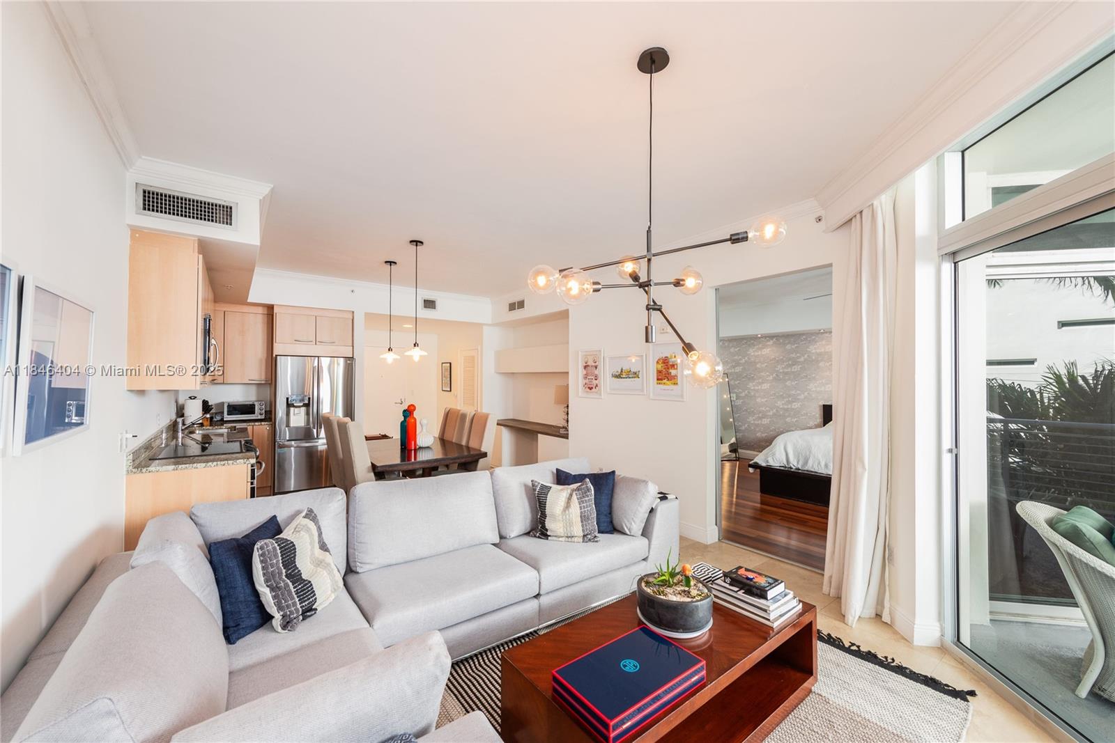 Beautiful loft-style one-bedroom with private balcony. This modern and spacious condo is furnished and features high 13-foot ceilings, a unit washer and dryer, a custom closet, and two parking spaces in the garage. The building features a rooftop pool, jacuzzi & sun deck with exquisite views, a gym & 24 hr concierge/security. It is a Perfect location, steps from Lincoln Road, Convention, and great restaurants.