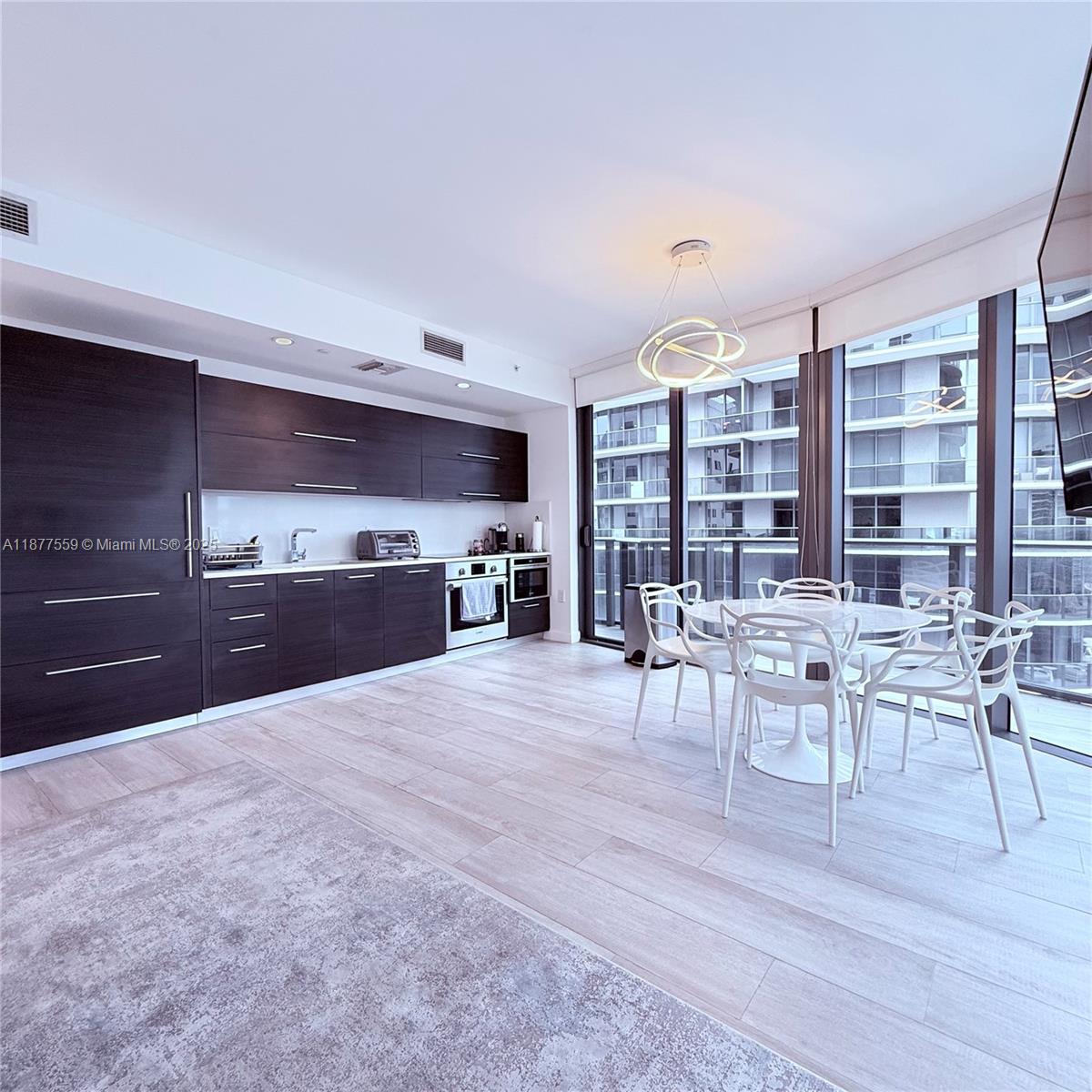 Spectacular FURNISHED 3BD/3BA unit with wraparound balcony, with stunning panoramic water views, Brickell &
Coconut Grove area. Top-of-the-line finishes, quartz countertop, tile-floor throughout, double sink in the master
bathroom, washer & dryer. This great building in Brickell offer elite services & amenities, luxurious shopping, and
fine dining. Indulge in a resort Lifestyle with Theater, Club House, Roof Top Pool, Jacuzzi, sauna, private massage
room, kids playroom, and Green Space for Gardening, located in the same building state-of-the-art Equinox Fitness
Club and Spa located at the ground level. SoulCycle indoor cycling studio. Across the street from Brickell City
Centre and steps away from Mary Brickell Village. EASY TO SHOW.