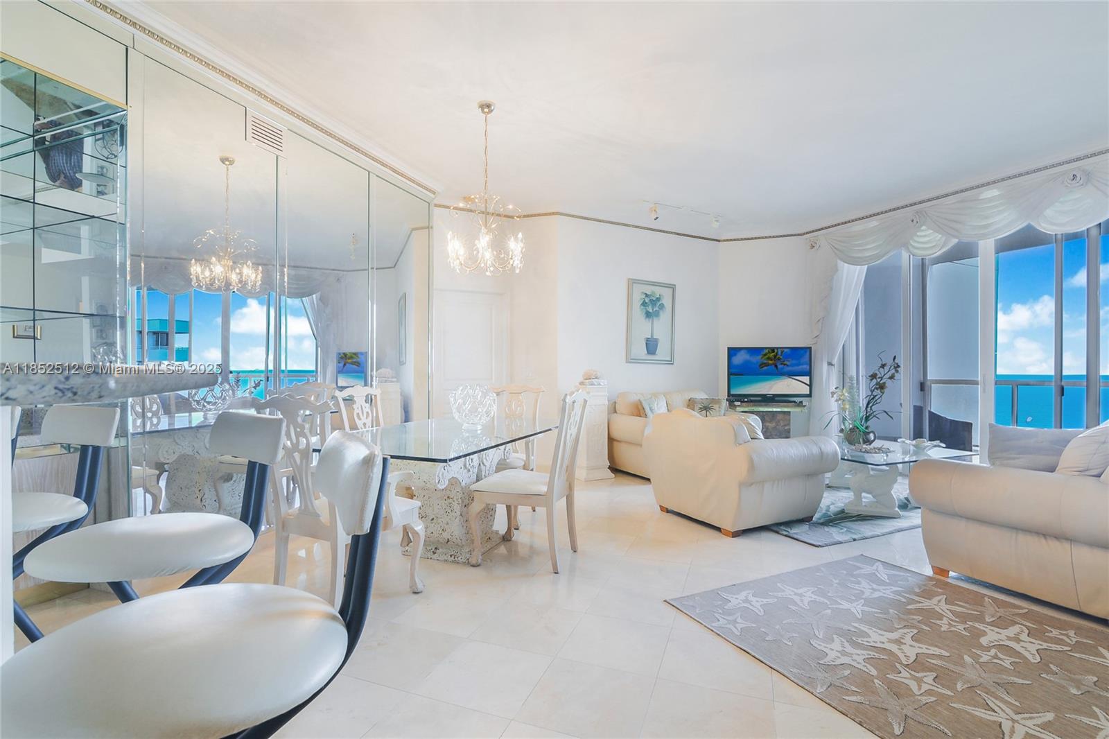 Step into elegance with this stunning lower penthouse featuring breathtaking ocean views and 11- foot ceilings. Fully furnished for your convenience, this gem includes access to top-tier amenities: a library, fitness room, billiard room, community room, and a relaxing sauna. Enjoy unparalleled convenience with close proximity to shops, the renowned Bal Harbour shopping center, and local houses of worship. Benefit from 24- hour security, valet service, and a dedicated parking space.