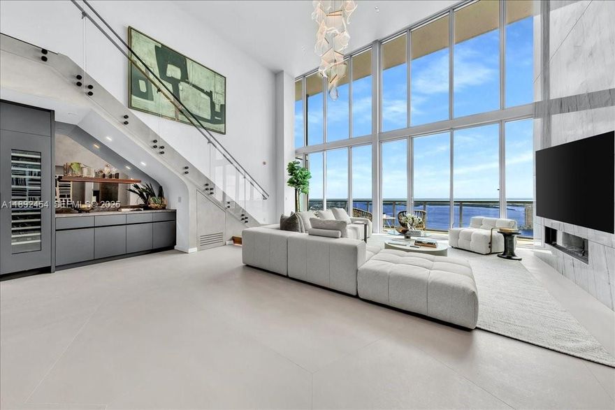A TRUE MASTERPIECE! Fully Renovated 2 Story Penthouse with over $1.3M in upgrades! No detail overlooked showcasing bespoke finishes & dramatic 20 foot floor-to-ceiling windows framing direct east views of the ocean & Intracoastal waters. Features include custom imported Italian flooring, Miele & Thermador appliances, wine cooler/bar, marble accent wall, Lutron dimmable lighting, Sonos sound system, & designer walk-in closets. Glide up your sleek staircase to your impressive marble walls, smart-glass privacy tint, freestanding tub, steamer shower, & Toto luxury toilet. Marina Blue is conveniently located steps from Kaseya Miami Heat Stadium, Bayfront Park, Bayside, One World Center, Arts district, Brickell, & endless high end shopping & restaurants. Monthly HOA is being reduced in 2026! Great Building with great reserves!