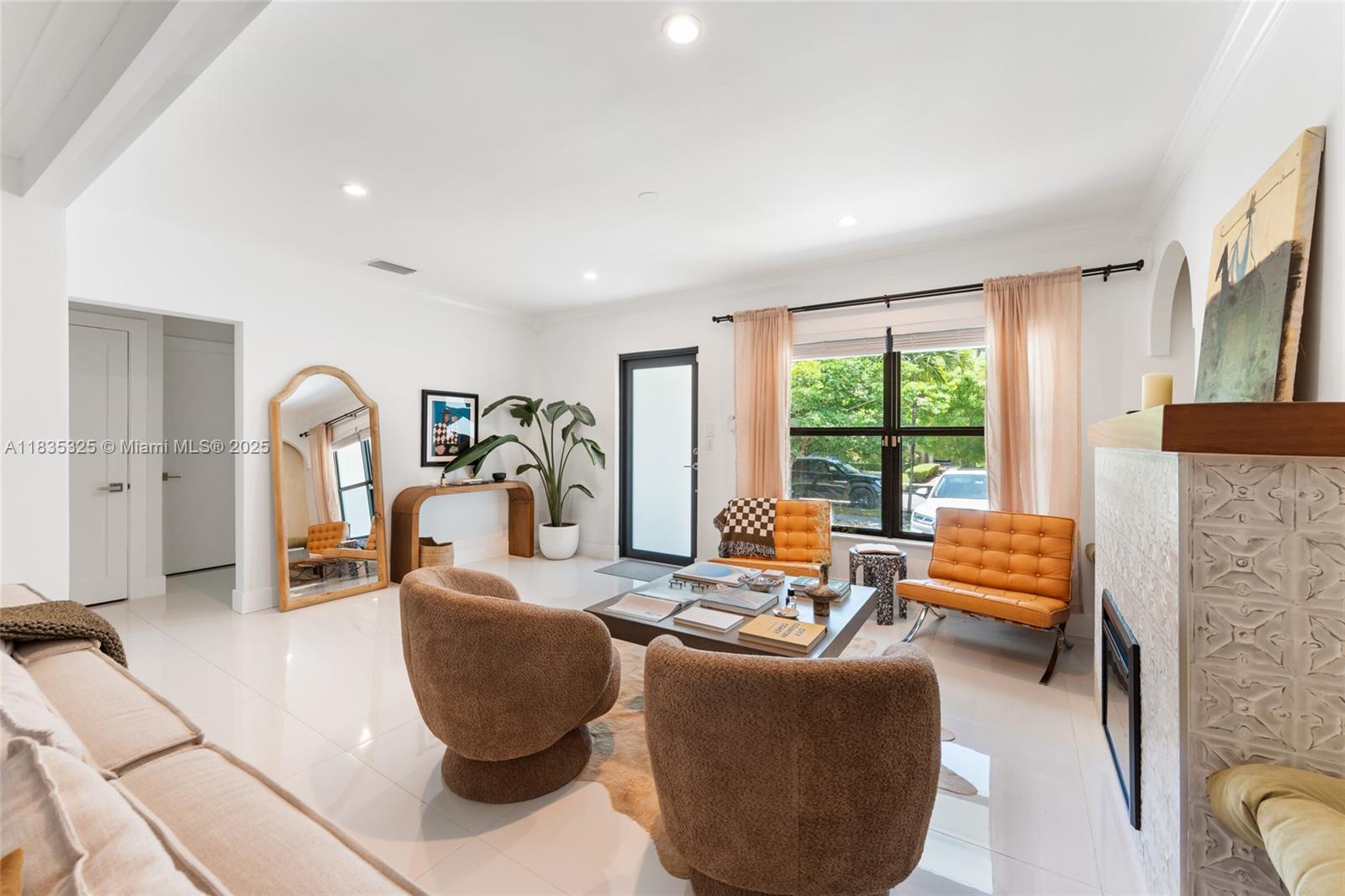 Location! Location! Location! Stunning 4 bed / 4 bath home in Miami’s desirable Shenandoah neighborhood, just minutes from Brickell, Coral Gables, Coconut Grove, Downtown, and Miami Beach. The main house features 3 bedrooms and 3 bathrooms with luxury finishes, including 32x32 porcelain tile, quartz countertops, impact-resistant windows and doors, custom cabinetry, and an electric fireplace. A separate 1/1 efficiency with private entrance offers flexibility for guests, in-laws, or rental income ($1,100+/mo). Move-in ready, beautifully renovated, and perfectly located!