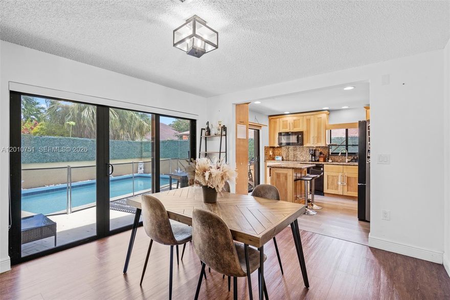 Step into this bright, move-in-ready home tucked inside a quiet gated community in North Miami. Vaulted ceilings and natural light from the high impact windows welcome you the moment you enter, creating an open and airy feel throughout the living spaces. The home features 2 bedrooms plus an additional versatile room, perfect for a home office, nursery, gym, or guest space. The layout flows seamlessly into the backyard, where your private pool becomes the centerpiece for relaxing weekends, entertaining friends, or enjoying South Florida living year-round. Owner is willing to help buyers with down payment. Tile Roof 2011, AC 2016, Copper and PVC pipes :)