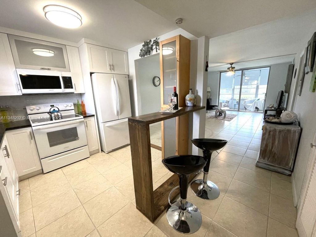 Photo of 9350 Sunrise Lakes Blvd #106, Sunrise, FL 33322 (MLS # A11348202)